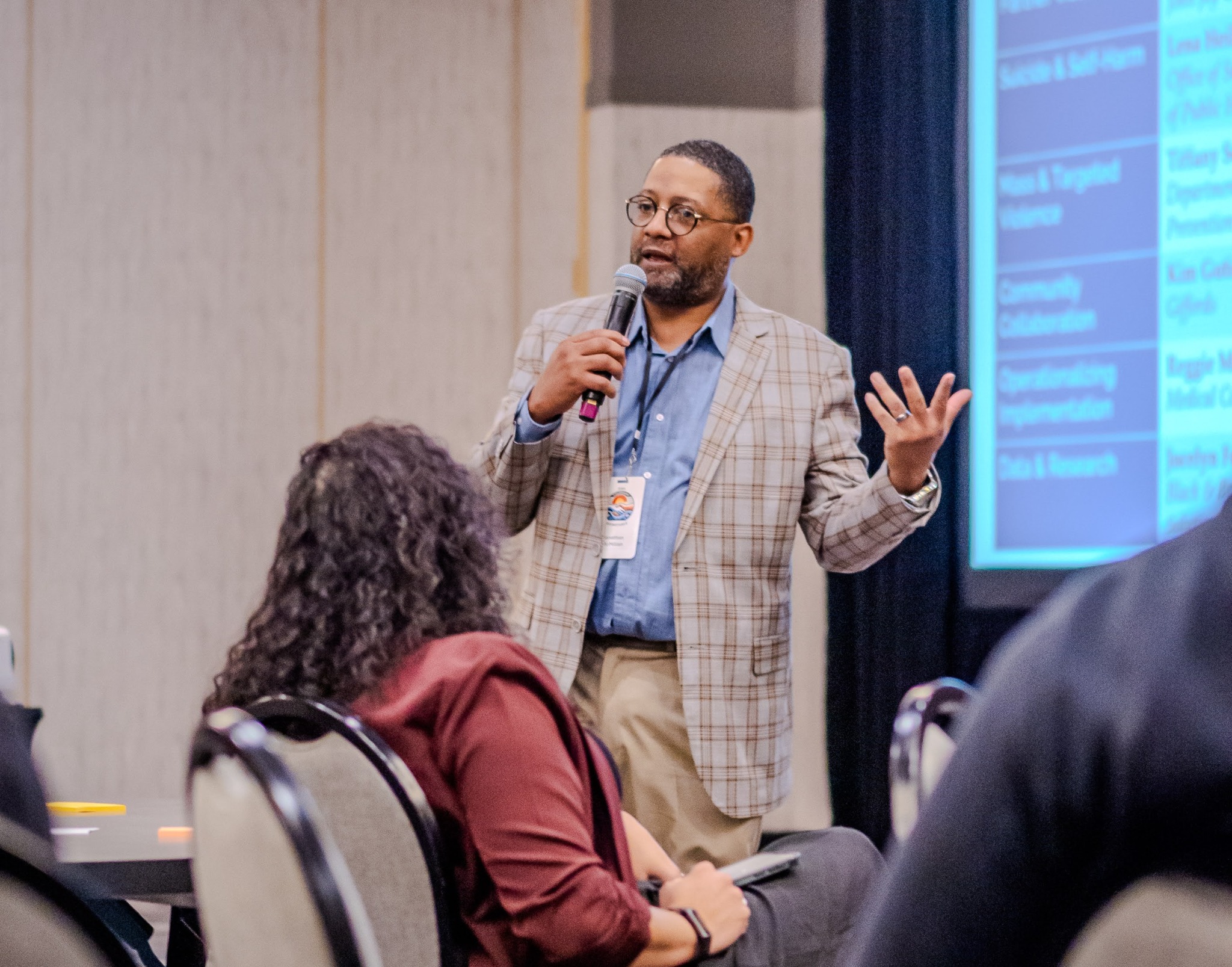 Jonathan McMillan speaking with participants at a Colorado public health and safety roundtable